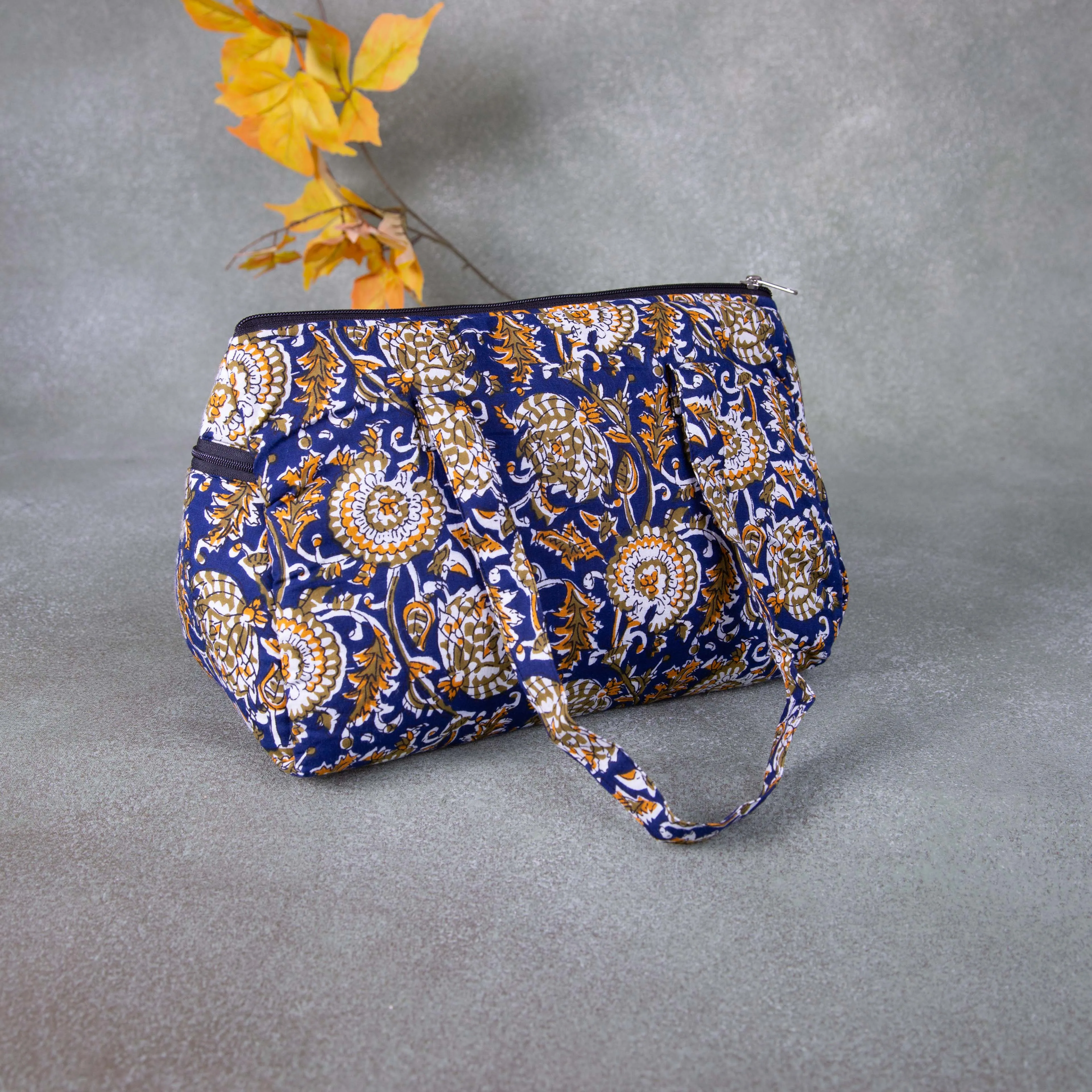 Barrel Handbags Blue with Mustered Flower Design.