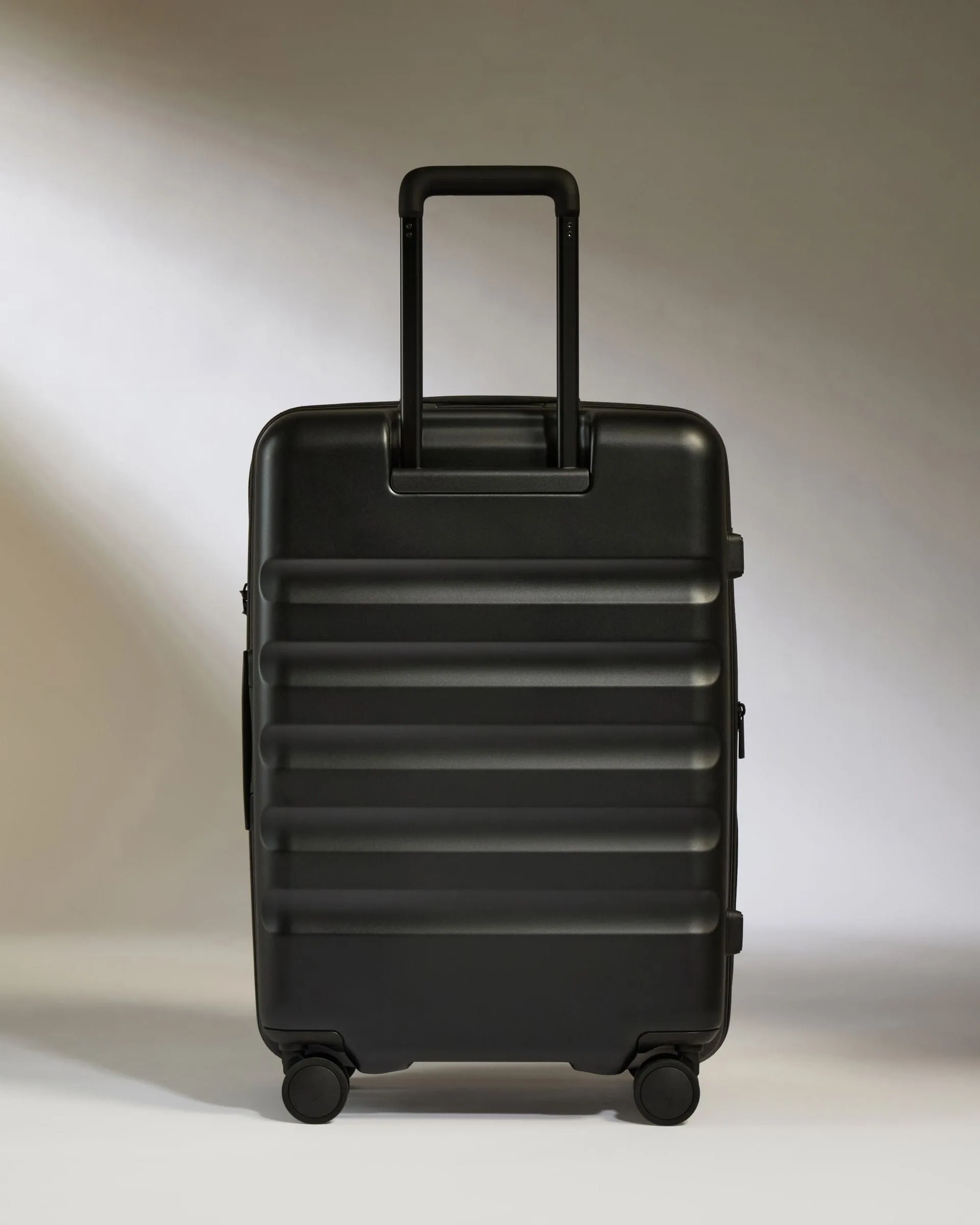 Medium Suitcase in Black - Icon Stripe