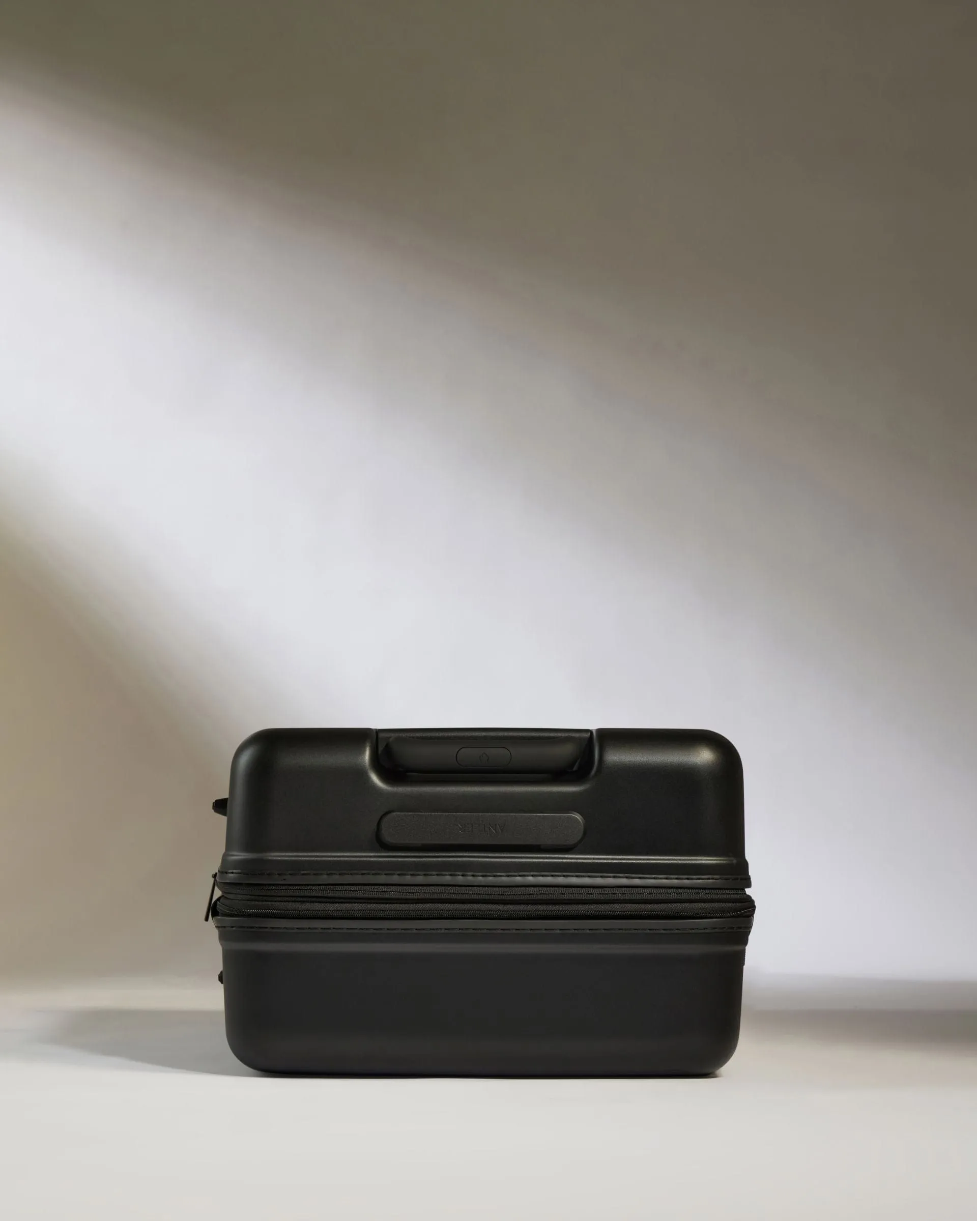 Medium Suitcase in Black - Icon Stripe